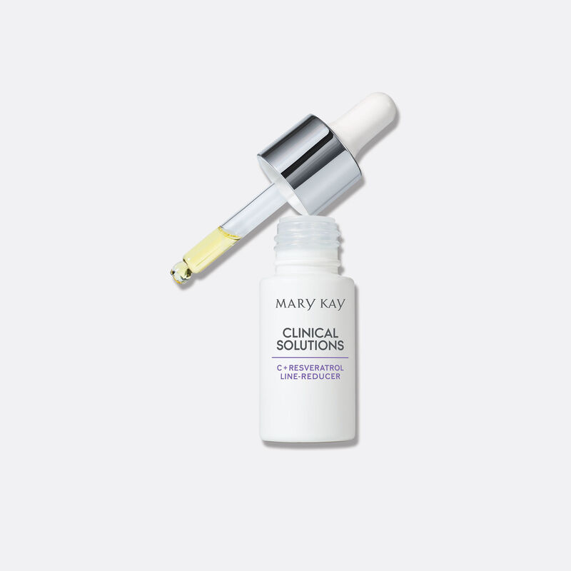 Open bottle of Clinical Solutions C + Resveratrol Line Reducer with dropper on plain background
