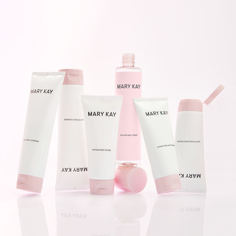 All products of Mary Kay Mattifying and Hydrating Regimens standing against a light pink background