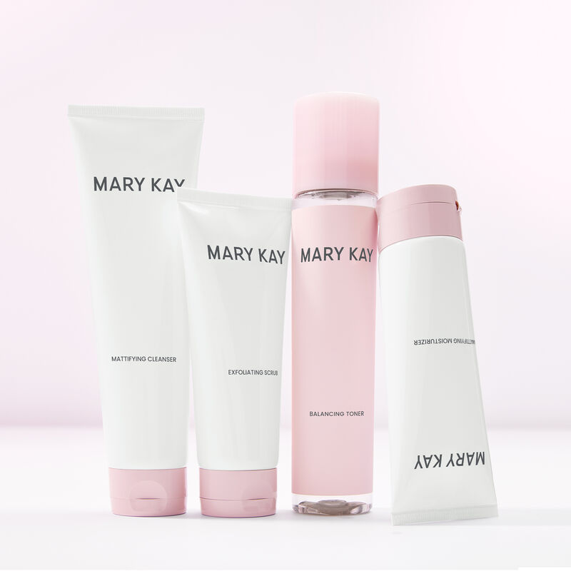 Entire line of Mary Kay Skin Care featuring a complete mattifying routine standing against light pink background