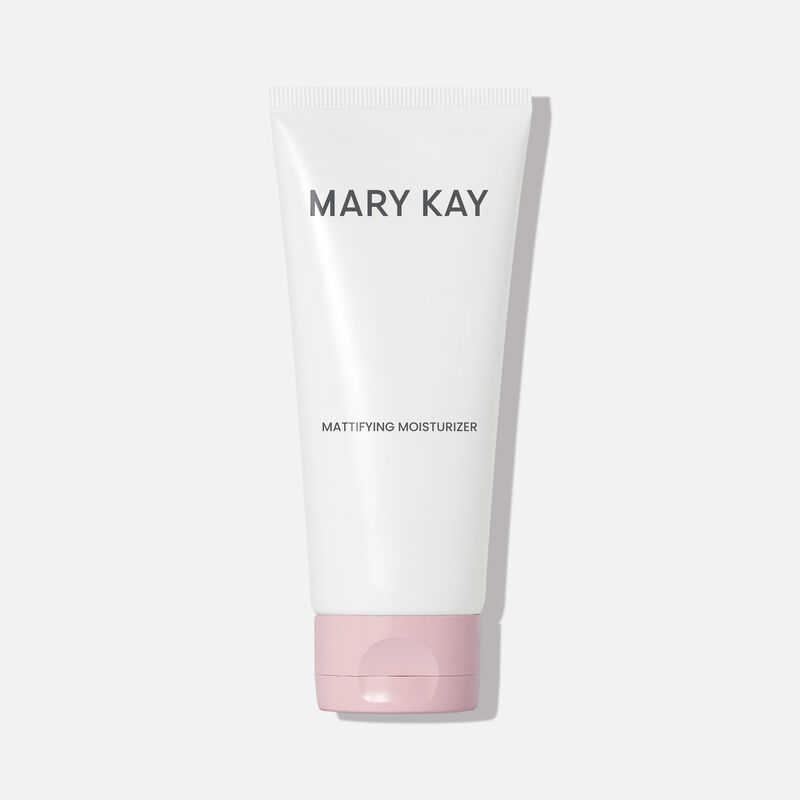 Tube of Mary Kay Mattifying Moisturizer standing on its cap against a gray background