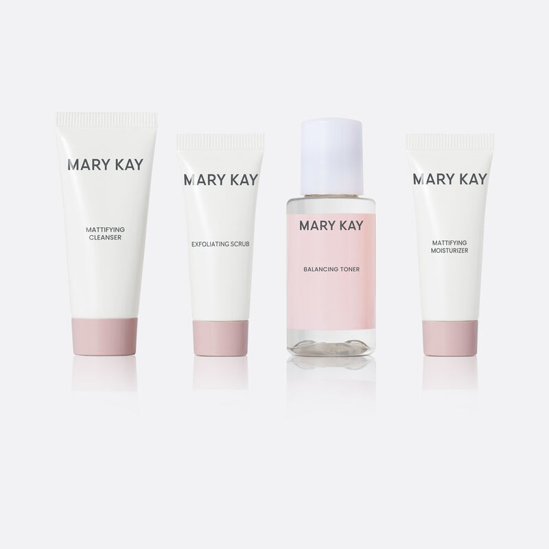 Miniature bottles of Mary Kay Mattifying Regimen on plain background.