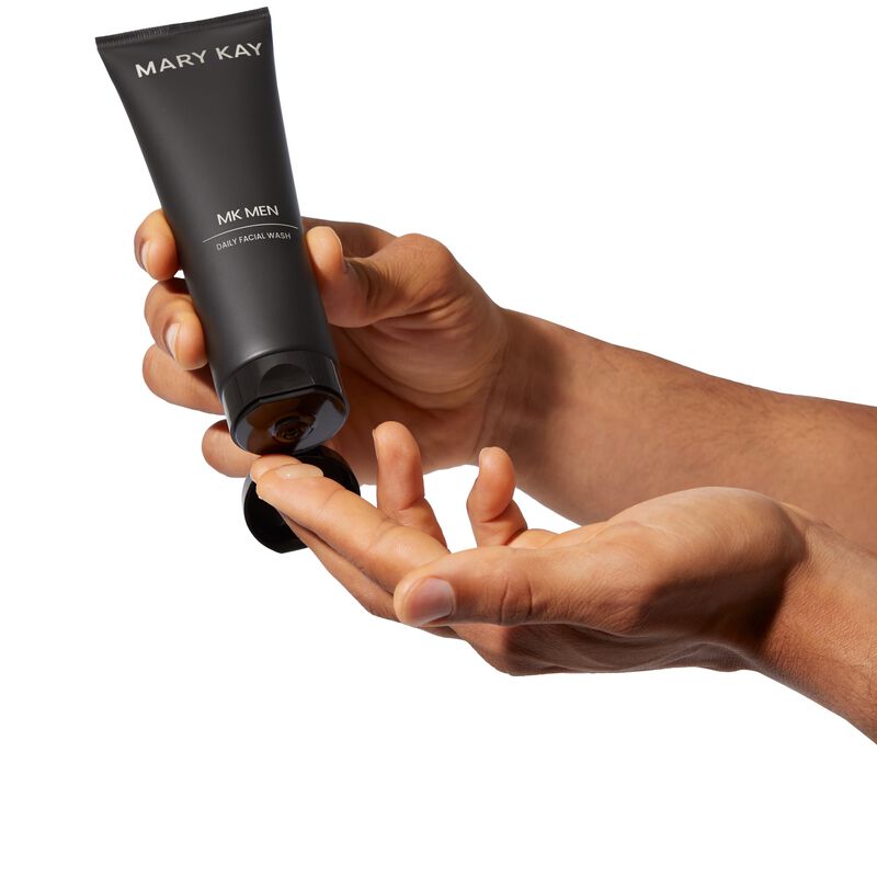 MKMen Daily Facial Wash being squeezed onto a man&rsquo;s fingers