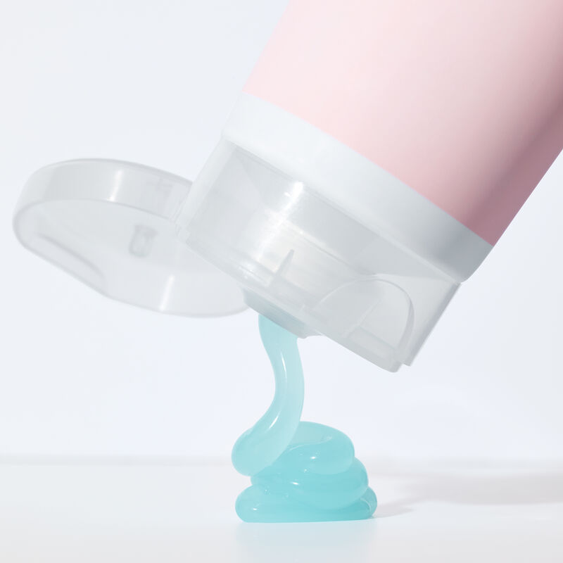 Blue gel product squeezing out of a tube of special-edition Mary Kay After-Sun Replenishing Gel