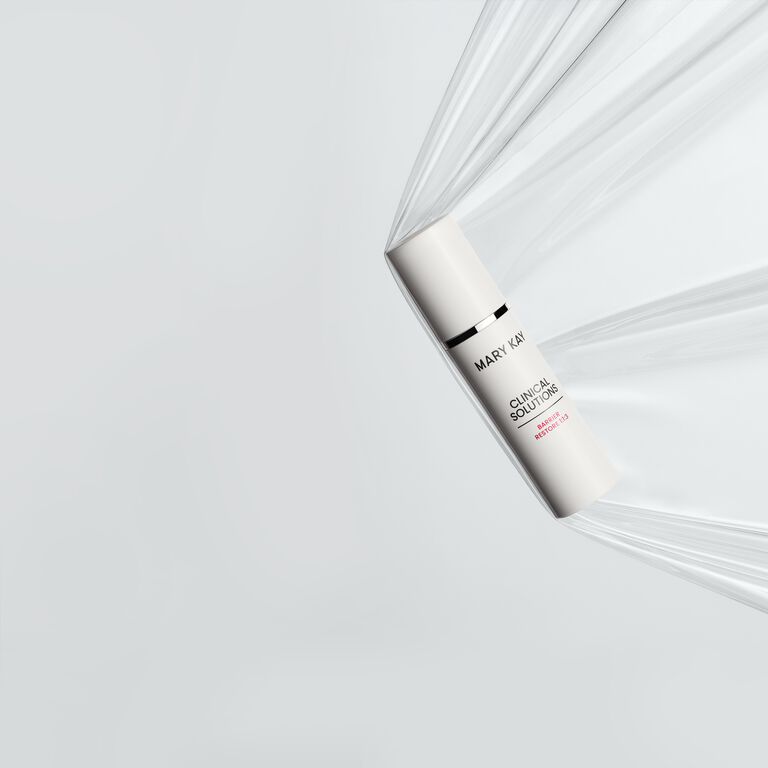 Bottle of Mary Kay Clinical Solutions Barrier Restore 1:1:3 suspended in a sheet of plastic representing a strong skin barrier