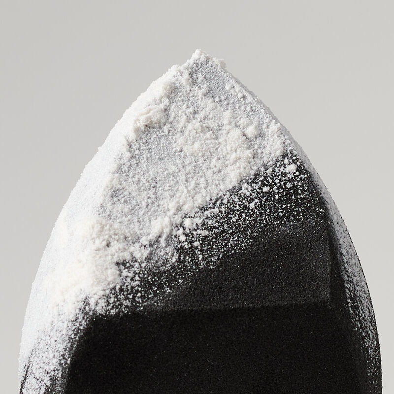 Mary Kay Complexion Sponge with Mary Kay translucent loose powder on surface