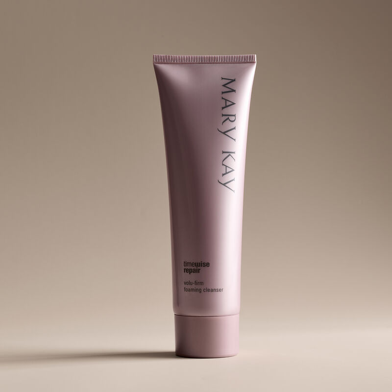 Stand-alone shot of Foaming Cleanser against beige background with shadows.