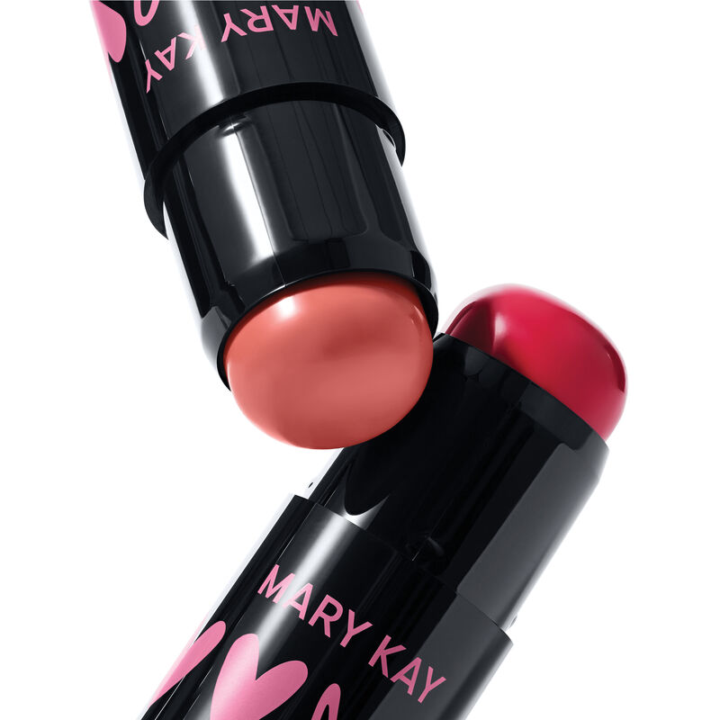 Two special-edition Mary Kay Blush Sticks in shades Kind Spirit and Spark Change in black tubes, displayed diagonally on a white background.