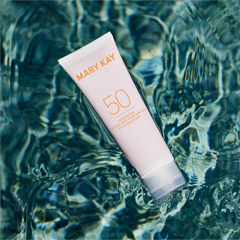 Tube of Mary Kay Sunscreen Broad Spectrum SPF 50 floating in water